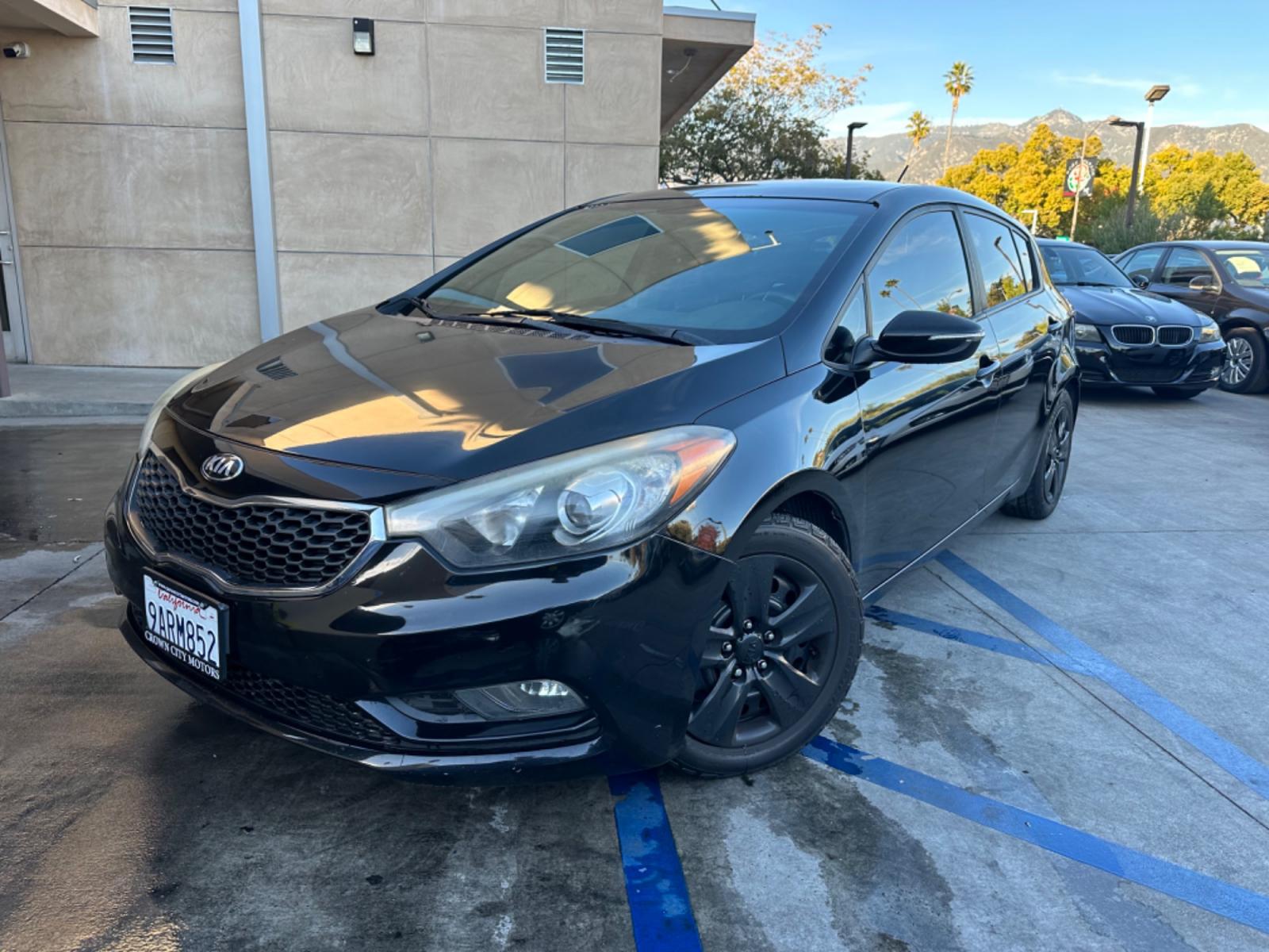 2016 Black /Black Kia Forte 5-Door Cloth (KNAFK5A87G5) with an 4 CYLINDER engine, Automatic transmission, located at 30 S. Berkeley Avenue, Pasadena, CA, 91107, (626) 248-7567, 34.145447, -118.109398 - Photo #0
